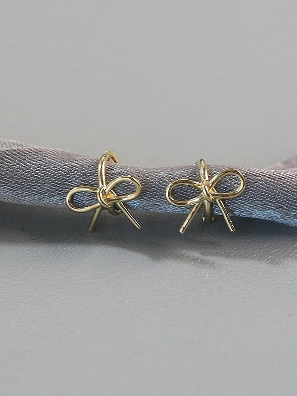 Dainty bow huggie hoops